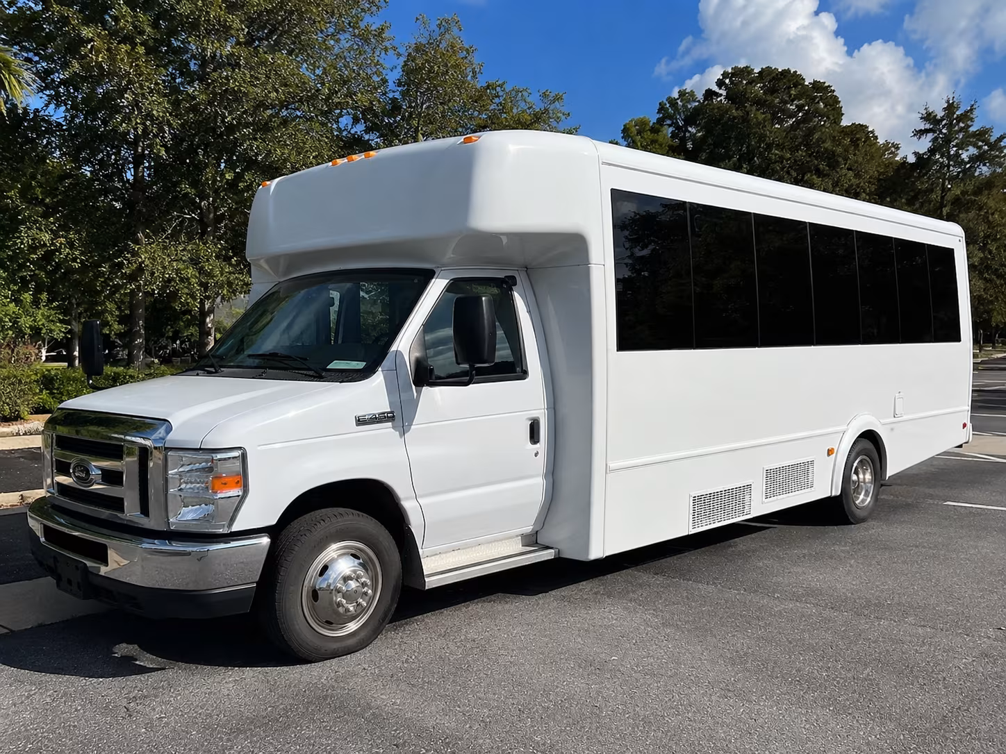 Group beside a Mercedes Sprinter limo in Fort Worth