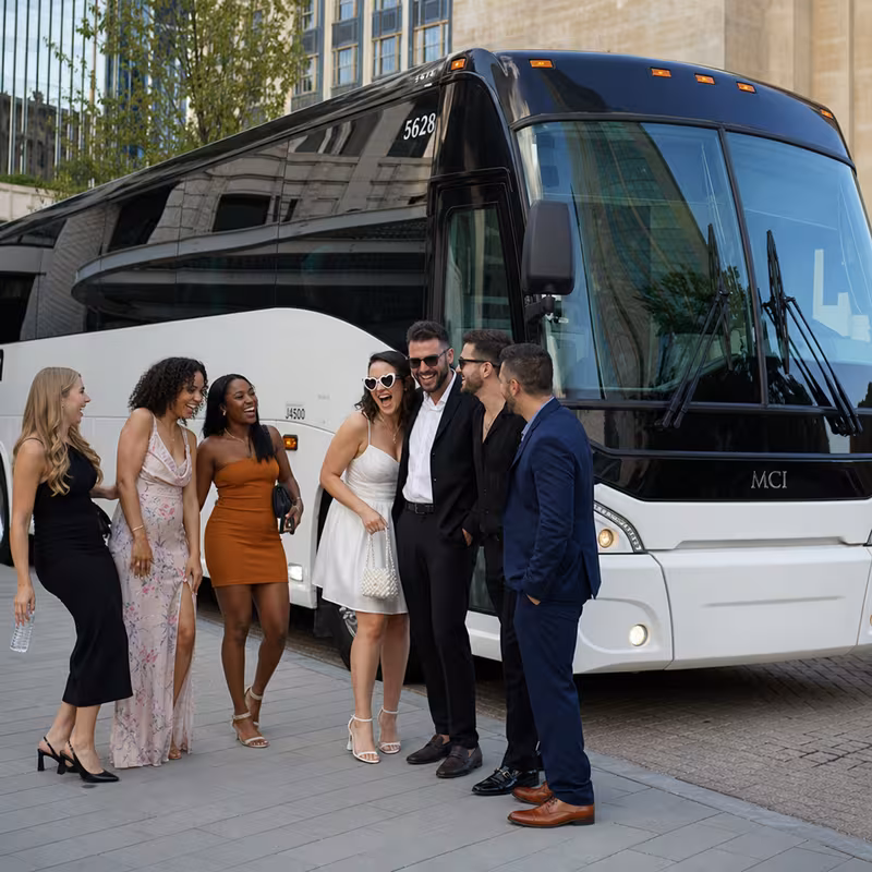 Passengers loading luggage while boarding an Fort Worth group shuttle