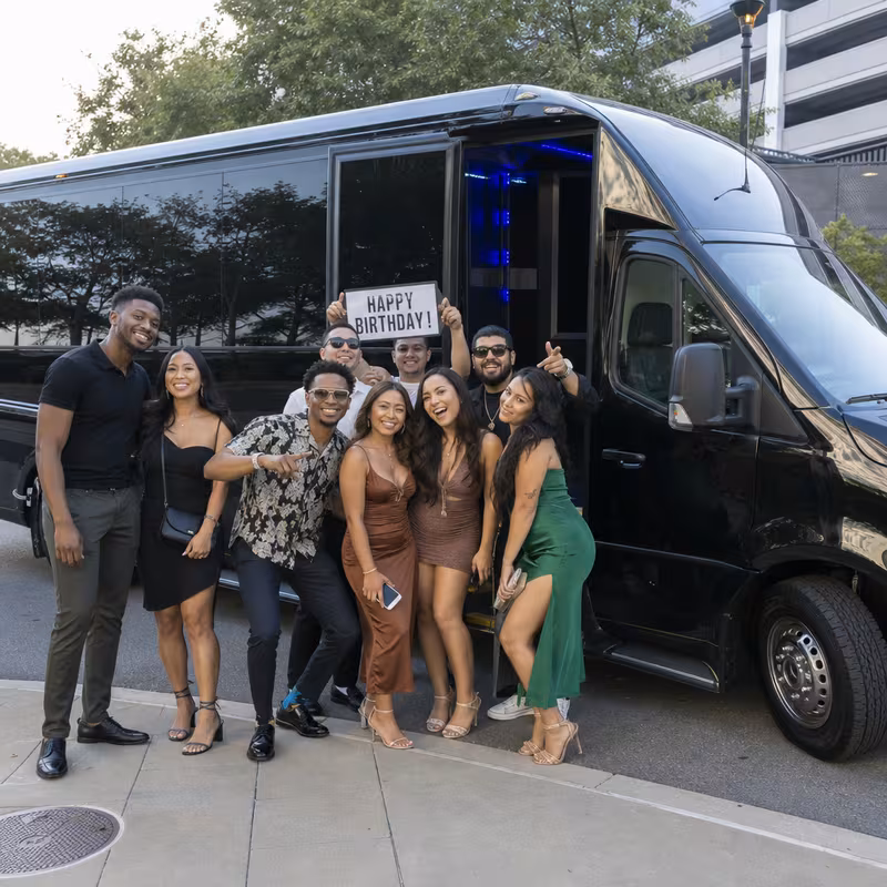 Party bus interior with wraparound leather seating and LED lighting in Fort Worth