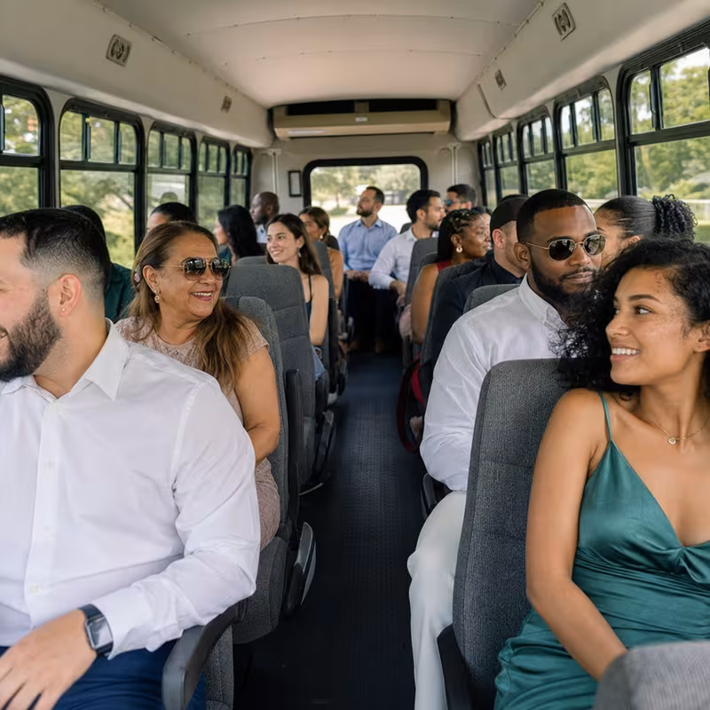 Group boarding a white charter bus for Private Event Transportation transportation in Fort Worth