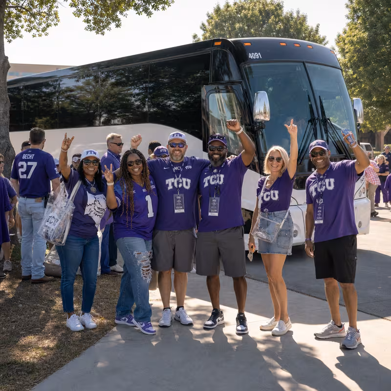 Passengers loading luggage while boarding an Fort Worth group shuttle