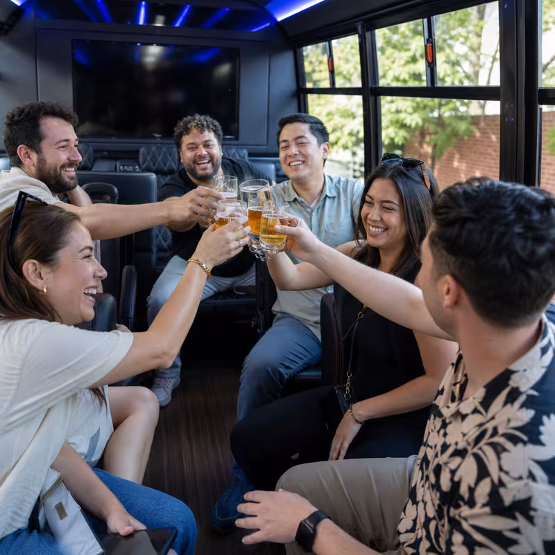 Group boarding a white charter bus for Winery & Brewery Tour Transportation transportation in Fort Worth