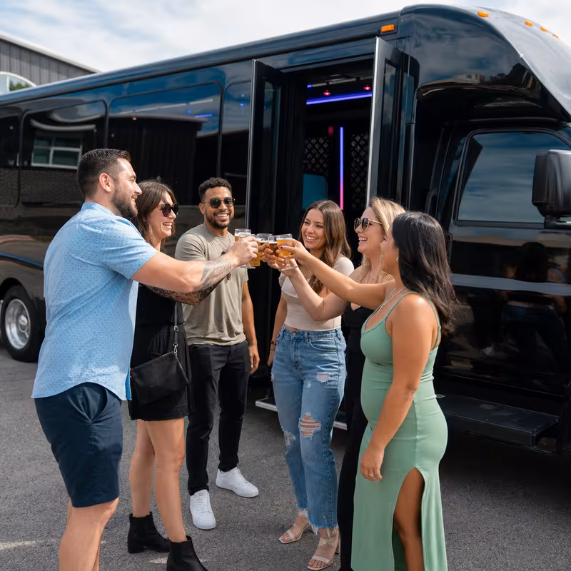 Passengers loading luggage while boarding an Fort Worth group shuttle